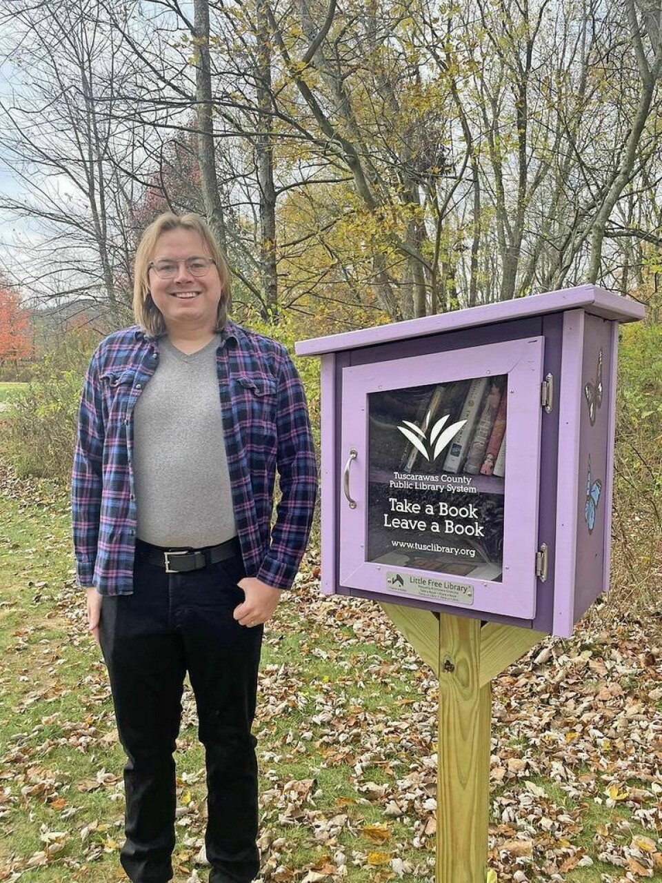 New Philadelphia resident Ben Foster with the Little Free Library he built. Southside gets Little Free Library