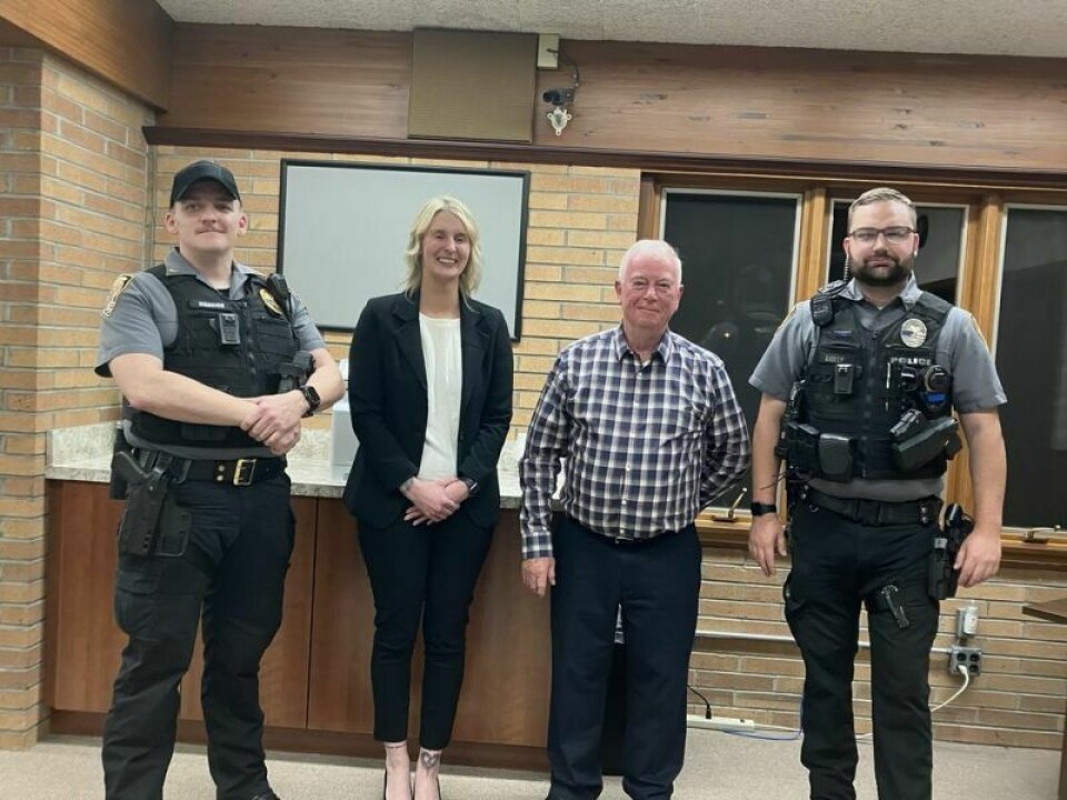 Police officer Dave Warrick, left, school resource officer Alison Rosenberg, Mayor Steve Smith and police officer Connor Bailey Rosenberg to begin duties in January