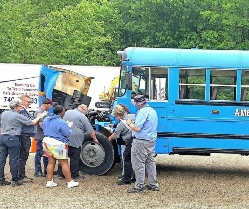 Examining and learning every part of school bus safety was part of a course for students seeking to become state CDL examiners. Area truck driving school trains state safety examiners
