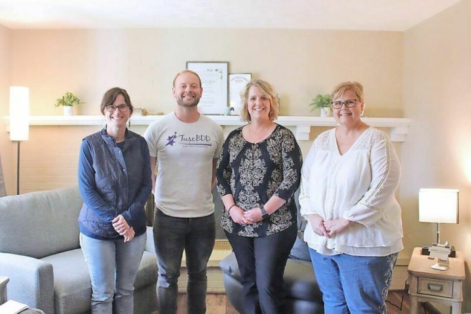 Kerri Silverthorn, Ray Snyder and Lisa Sidoti, all of TuscBDD, and Tonya Thomas of Starlight Enterprises Inc. in the living room of the technology first home. The TuscBDD and SEI worked together to create the tech house. New home has everything to make life easier for people with disabilities