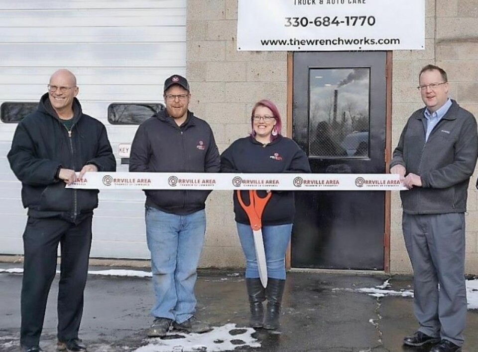 WrenchWorks owners Kevin and Kelly Kruft prepare to cut the ribbon held by Orrville Mayor Matt Plybon, right, and Orrville Area Chamber of Commerce President Dan Franks, left, in celebration of the opening of their Orrville shop. WrenchWorks celebrates grand opening in Orrville