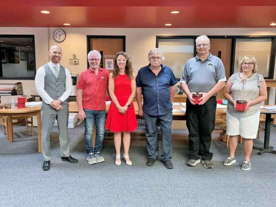Superintendent Dr. James Millet, left; John Shrock, board member; April Beachy, board president; Bob Eckert, board member; and Glen Huffman and Luann Wieland, retirees Garaway staff recognized for retirement