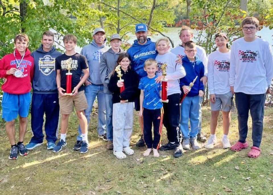 Winners from last year’s Pedal to the Medal 5K Fun Run & Walk show off their runner’s medals and fishing derby trophies. The fundraiser brings awareness to suicide and addiction awareness. The third annual event will be Oct. 1 at Gross Lake in Wooster. Pedal to the Medal 5K Fun Run & Walk is Oct. 1