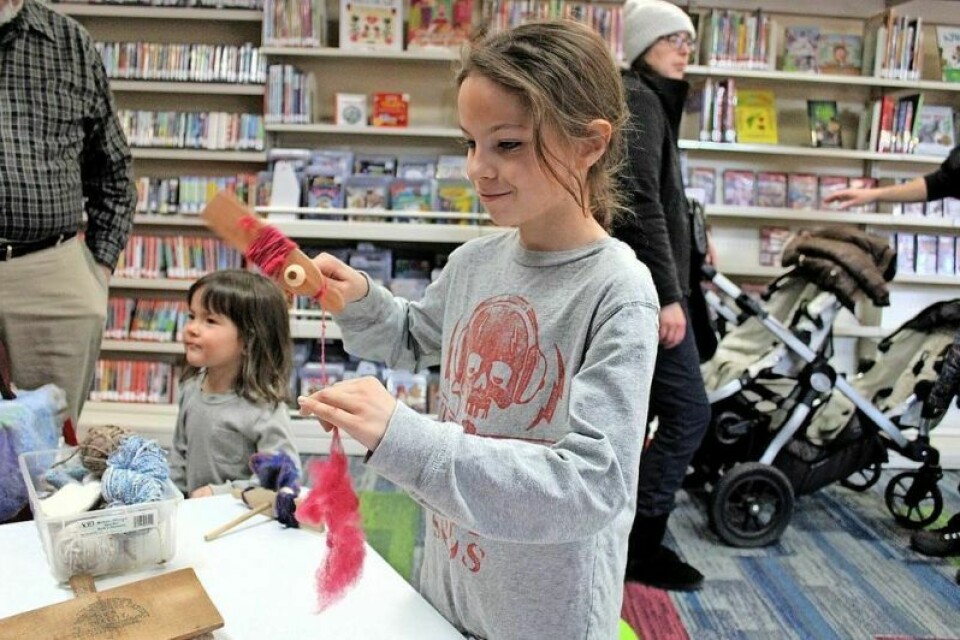 Asher Miller, 8, of Pomeroy tries his hand at using a Guatemalan spinner to make yarn. His grandparents live in Tuscarawas County. Sustainable Living Faire a popular event