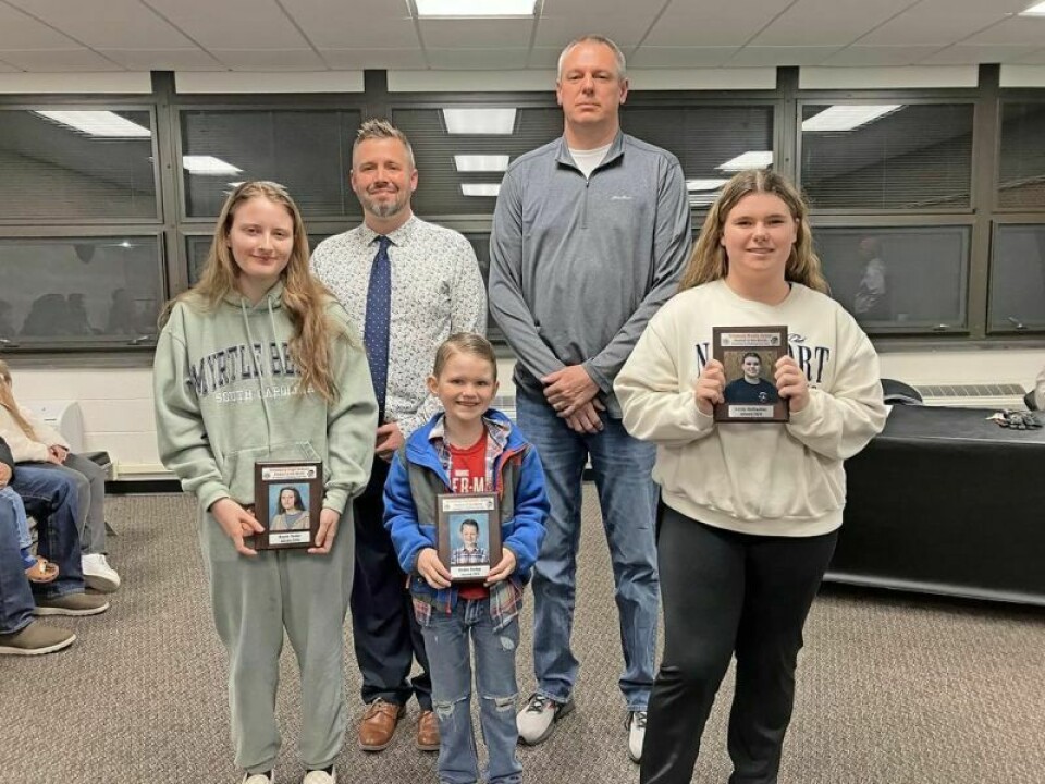 Kayla Yoder, front left, Brodee Bailey and Emily Rothacher, January Student of the Month recipients; back row, Jordan Boggs and Brent Miller, new school board members. New members are appointed to the Strasburg BOE