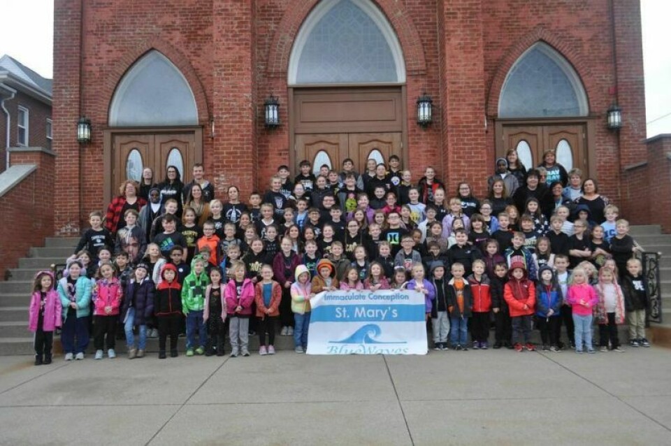 Students and staff pose for a picture in support of Tuscarawas Valley, Carrollton and Buckeye Career Center after collecting money. Students’ love for community shown through service