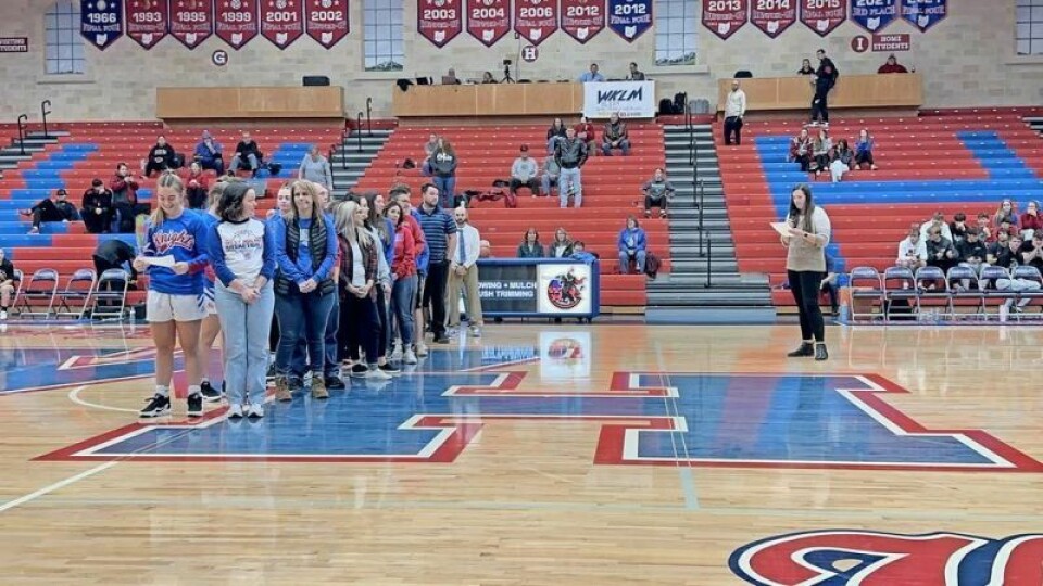 West Holmes Lady Knights head basketball coach Lindsy Belden describes the process her players went through in selecting their respective favorite teachers who made an impact on them. WHHS athletes honor teachers at event
