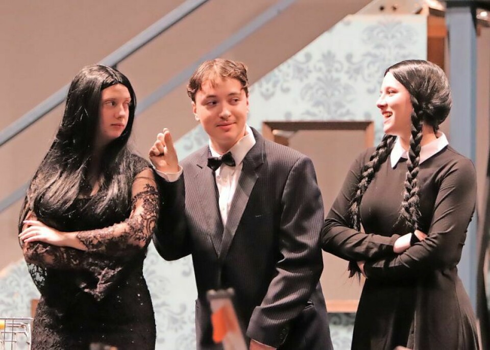 Gomez Addams, played by Danny Proańo, middle, is caught between lying to his wife Morticia, left, played by Emily Hammond, and keeping his daughter Wednesday, right, played by Daisy Carmon, happy. The Wooster High Drama Club's production of 'The Addams Family Musical' will begin Nov. 11. Wooster drama club set to present ‘The Addams Family Musical’