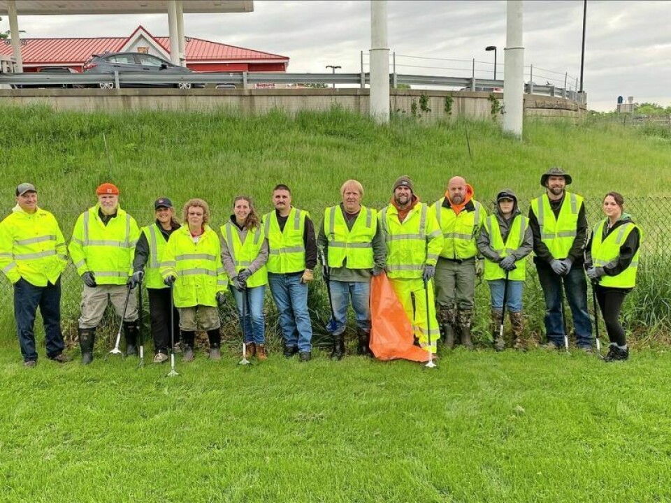 Volunteers from the community joined Lawrence Township trustees and staff members to clean up the grassy areas near I-77. Repairs and resealing on walking trail are complete