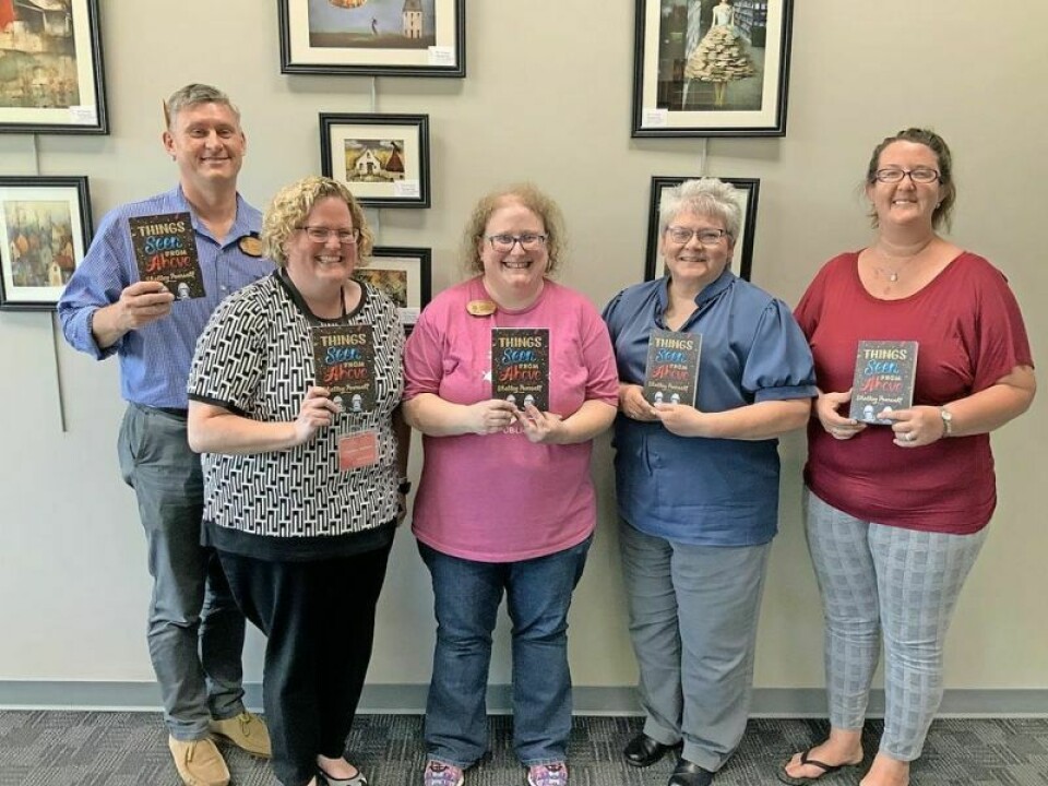 Jim Gill, left, Courtney Wallace, Liz Strauss, Wanda Krocker and Rachael Bowers are all members of the One Book One Community Committee. Community events planned for annual literacy program