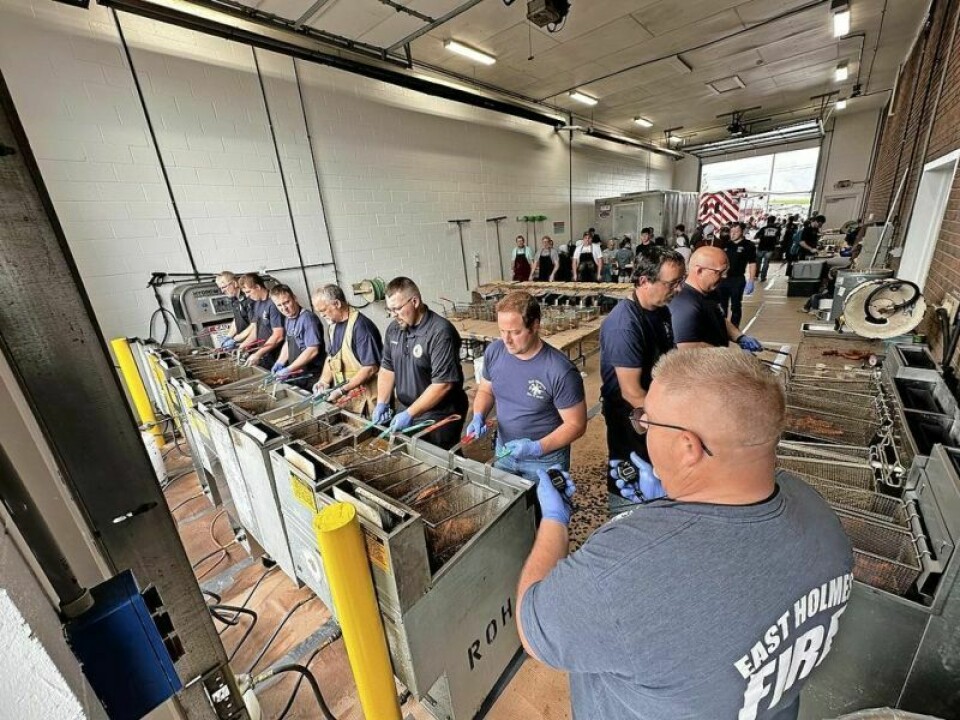 Under the expert leadership of Ben Miller, right, a team of East Holmes Fire & EMS volunteers prepare to simultaneously get their fish frying. The team fried 1,700 pounds of fish in the community celebratory fundraising event on May 17. East Holmes Fire provides a fish tale worth retelling