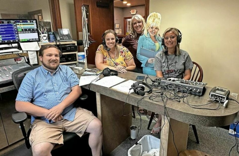 WKLM on-air personality Jake Sidle, left, is joined by United Way of Wayne and Holmes County members Kayley Cox, Katie Koglman and Megan Wilson, who were recently in Holmes County promoting the Dolly Parton Imagination Station book reading program. United Way promotes reading, so much more