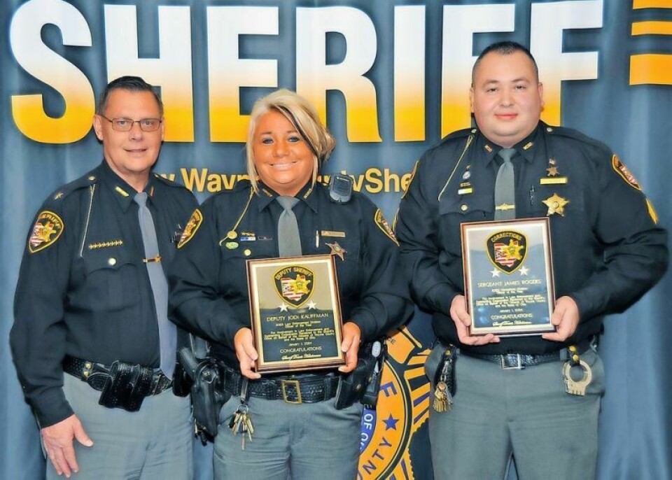 Wayne County Sheriff Travis Hutchinson, left, recently named deputy Jodi Kauffman, middle, and Corrections Division Sgt. James Rogers the 2023 Officers of the Year. Wayne County names 2023 Officers of the Year