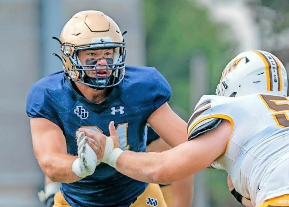 One of the key defensive players for John Carroll’s 6-1 football team is defensive lineman Jacob Phillips, left, an Orrville High grad. Ex-Rider Phillips a key cog in Blue Streaks’ defense
