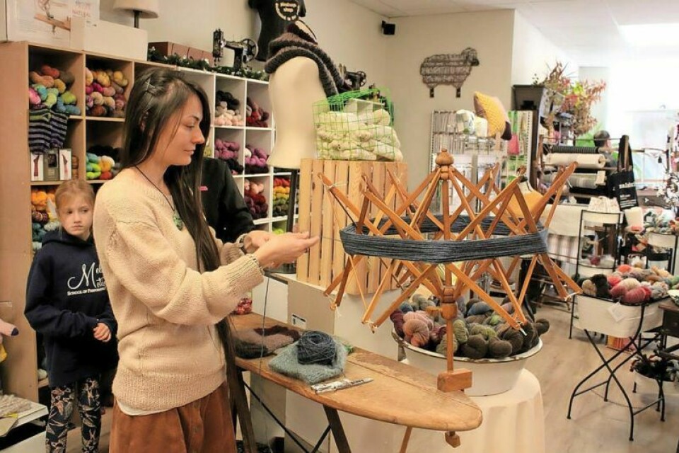 Jessika Zontini of the Pindrop Shop prepares to transform a skein of yarn into a ball for easier crafting. Christkindle Market brings joy to the Twin Cities