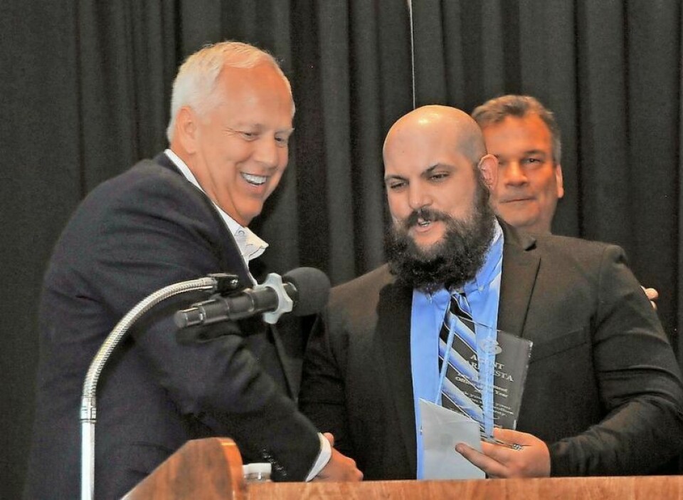 Charlie Hardman, left, retired sheriff’s office captain and Wooster Exchange Club member, presents senior Medway agent Carl Festa with the Law Enforcement Officer of the Year. Festa named Child Abuse Prevention Officer of the Year