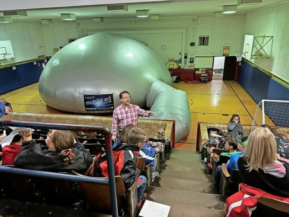 Brian Zimmerly, Nashville and Lakeville elementary principal, explains how the process of viewing the inside of the Mobil Ed planetarium will work prior to the students being dazzled by what took place inside. Nashville, Lakeville students see stars during Mobile Ed visit