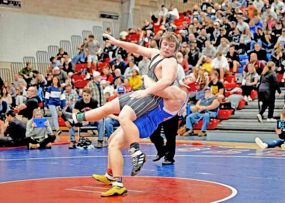 Grant Miller, right, was one of two West Holmes wrestlers to win an individual title at the 17-team Cambridge Invitational on Dec. 9. Dixon, Miller lead Knights wrestling at Cambridge Invite