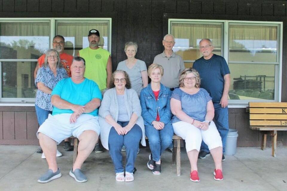The members of the Midvale Miners Jubilee committee met recently at the pavilion at Midvale Park. Pictured are Randy Cadle, front left, Donna Kohler, Stephenie Wilson, Lynette Kopp; back row, Vicki and Mark Bassett, William Weaver, Candie and Rod Wilson, and Midvale Mayor Larry Kopp. Midvale Miners Jubilee to be held Sept. 8-10
