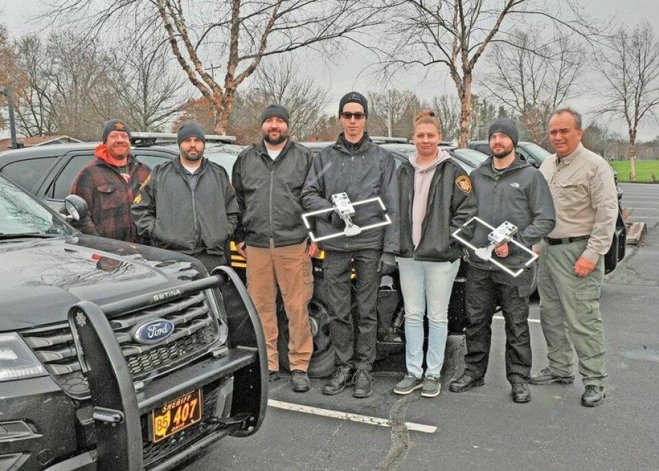 Wayne County Sheriff’s Office deputies Sgt. Kirk Shelly, left, Sgt. Matt Estacion, Sgt. Dan Broome, deputy Zak Harriman, deputy Allie Wood, Sgt. Tyler Hankins and retired Capt. Doug Hunter stand outside the communications building on Oldman Road in Wooster after completing their training on the proper use of the Project Lifesaver radio frequency equipment used to locate persons with cognitive decline who have wandered away from their residence. Deputies learn more than the technical aspects of the equipment; they are trained to approach an individual with a cognitive impairment properly. Wayne deputies trained on Project Lifesaver equipment