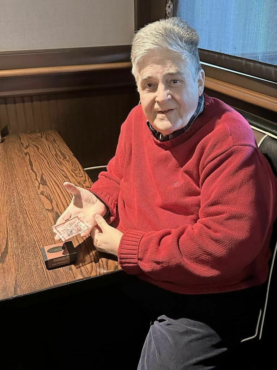 Rex Huffman, who interviewed a Titanic survivor, holds a small piece of coal taken from the ocean floor where the ship had broken open. Veteran director recalls interviewing Titanic survivor