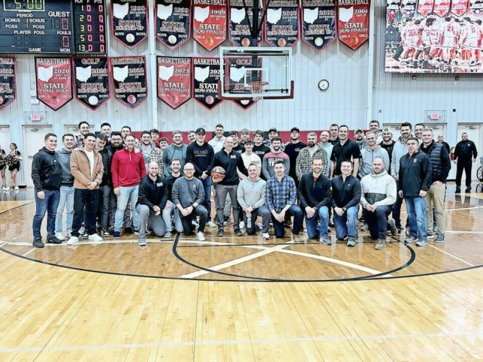 Close to four dozen former basketball players who played for current Hiland head coach Mark Schlabach visited the Reese Center at Hiland High School recently to celebrate Schlabach's 500th win. The players were from Loudonville and Hiland. Redbirds, Hawks help celebrate a monumental mark