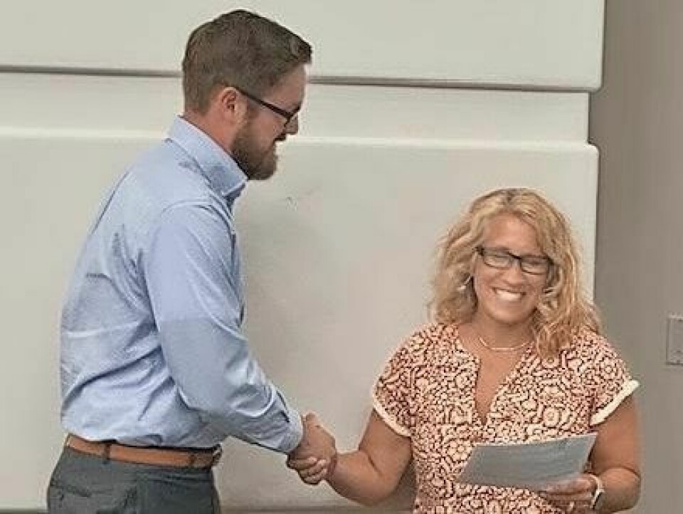 Cody Austin, left, is welcomed to the Wooster City Schools Board of Education by WCS treasurer Amy Welty on June 18. Austin fills a vacancy left by Danielle Schantz. Austin joins Wooster school board