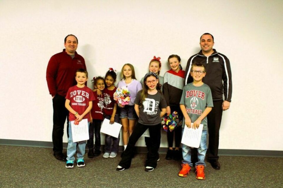 Students from the Dover Elementary PTG who are involved in community service pose for a photo with Council President Justin Perkowski and Mayor Shane Gunnoe. Funds for many projects will improve city