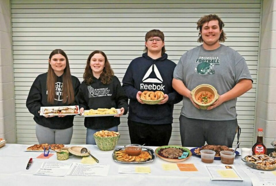 Smithville High School Foreign Language Club members Nylah Kaufman, left, Ava Windhurst, Jacob Johns and Eric Lehman show off their dishes at the club’s annual cooking contest. SHS Foreign Language Club gets cooking