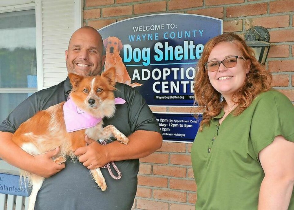 PAWS President Brock Yoder, left, and Katelyn Lehman, dog warden and shelter director, pose with kennel resident “Jill.” The shelter is over capacity and is asking for volunteers and donations to ensure every dog can have an opportunity for a happier, healthier life. Wayne dog shelter understaffed, overcapacity