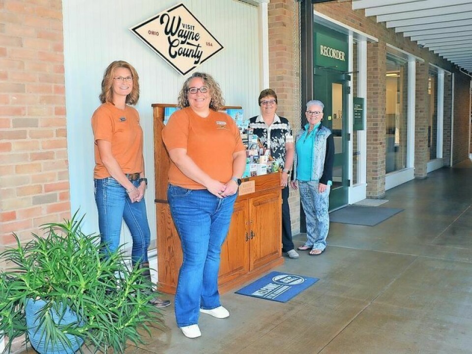 Wayne County Convention and Visitors Bureau staffer Heather Reed, left, Director Shannon Carter, former Director Martha “Marty” Starkey and former staff member Judy Mowrer pose together during a recent open house to introduce the bureau’s focus on agritourism. New WCCVB director’s focus is on agritourism