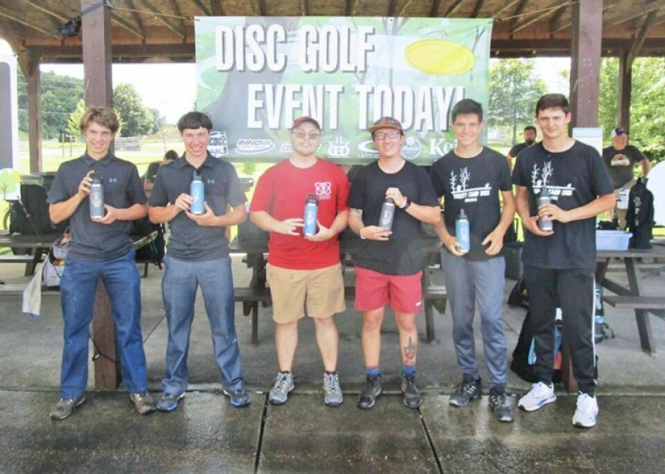 At the recent disc golf doubles tournament held at Deer Run, Alan Hilty, left, and Anthony Hilty were second at 18-under, Derek Schmidt and Nicholas Blair took first at 21-under, and Brandon Yoder and Grant Yoder were third at 17-under. Holmes disc golf club holds doubles tourney