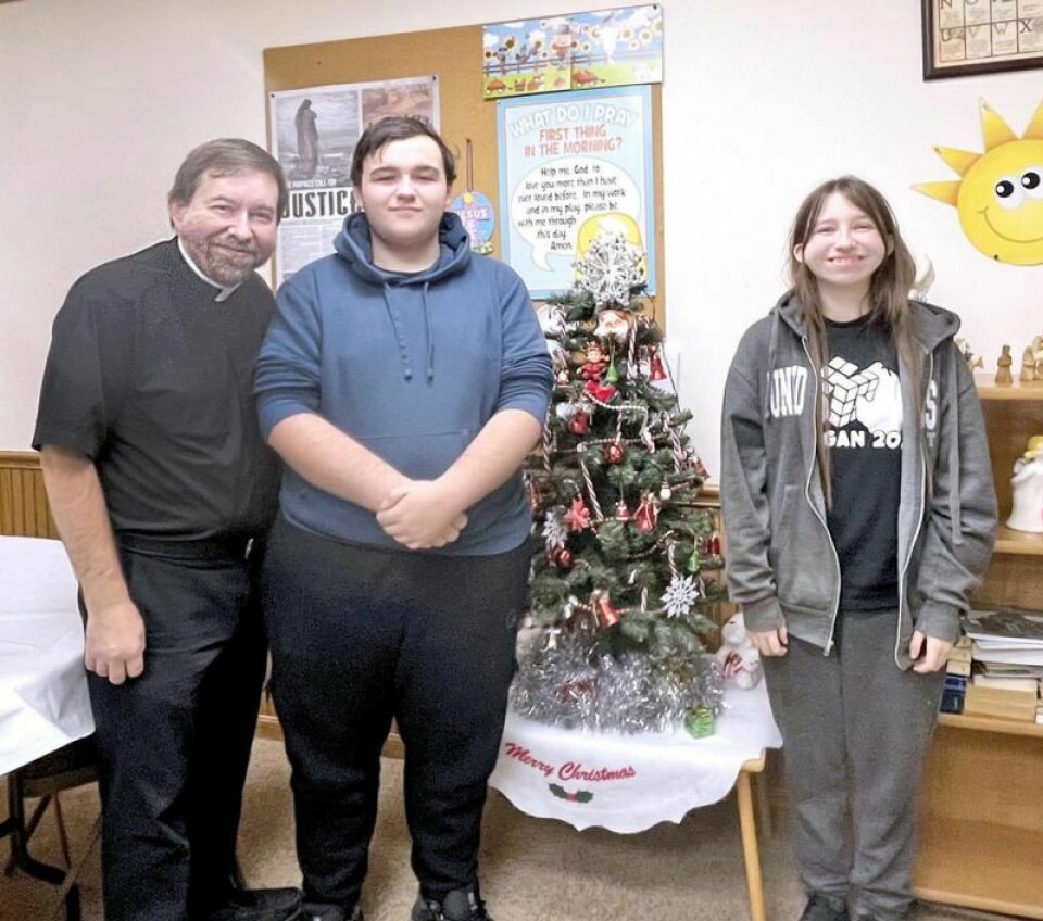 Zoar UCC Pastor Dan Grimminger with his children Justus and Julia in the Sunday school room. Zoar United Church of Christ welcomes new pastor
