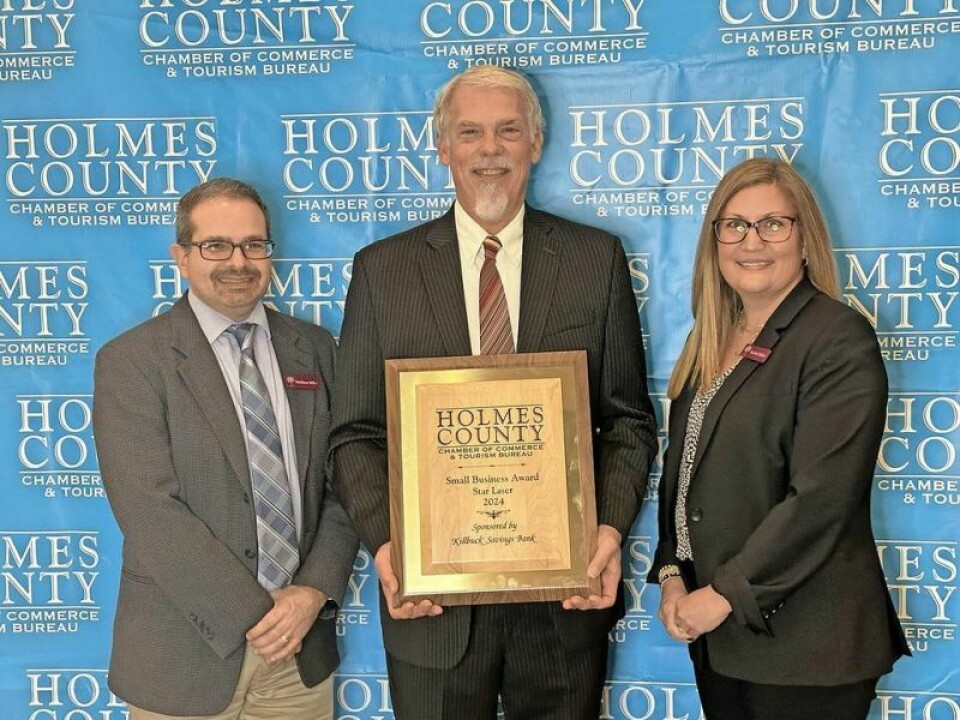 Wes Schmucker, owner of Star Laser, joins Killbuck Savings Bank’s Matthew Miller, left, and Rachel Miller during the recent Holmes County Chamber banquet as they celebrate Star Laser being tabbed as the chamber’s Small Business of the Year. Schmucker humbled, grateful for growth of Star Laser