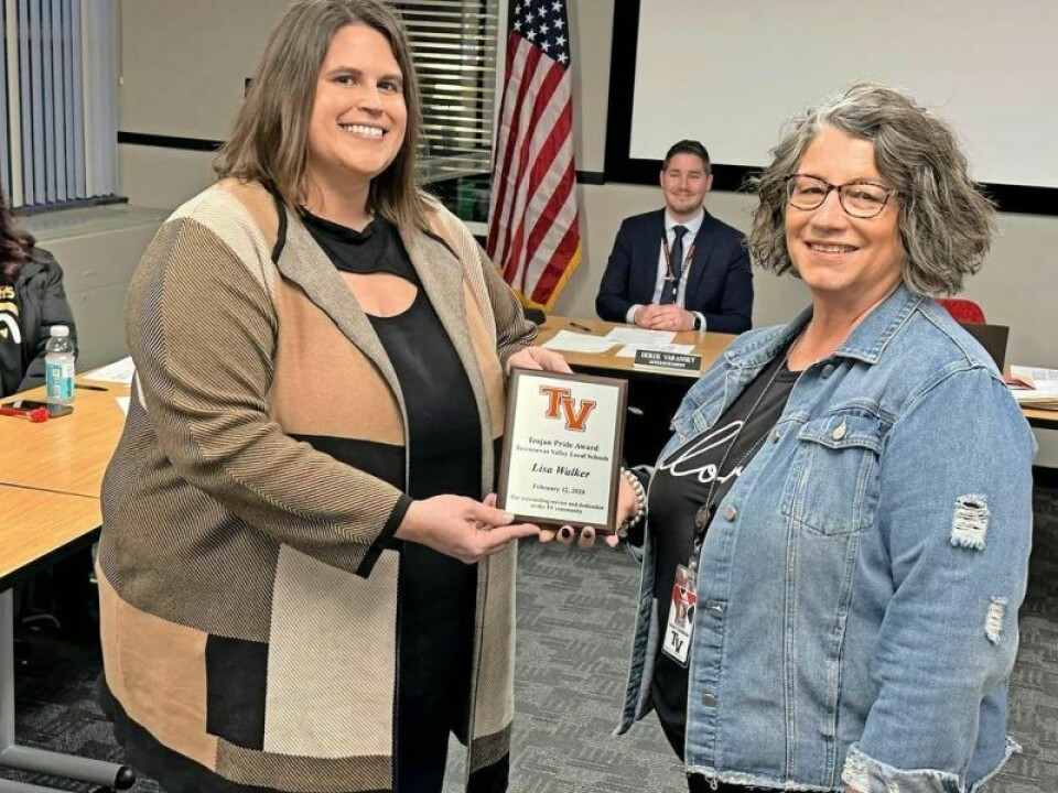 Lisa Walker, director of TUFF Bags, left, and Diana Flickinger, TV family advocate. Walker received the Trojan Pride Award. Trojan Pride Award presented