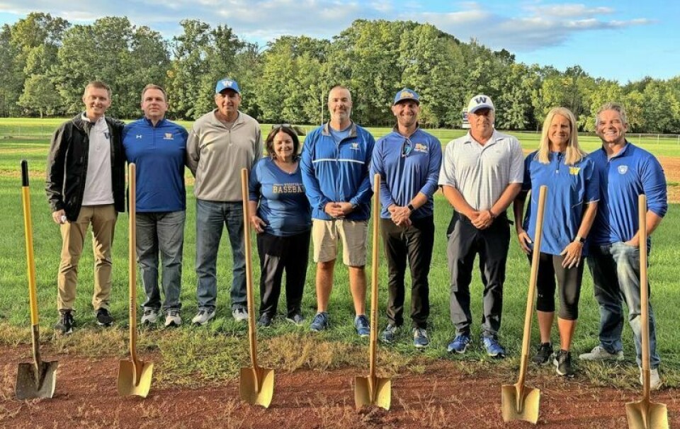 Leading the way for the Wooster baseball and softball turf campaign were committee members Alex Mallue, left, Joe Winge, Doug Johnson, Bobbie Douglas, Steve Young, Jimmy Williams, Tim Pettorini Jr., Carrie Becker and Larry Poulson. Wooster breaks ground on baseball, softball turf project