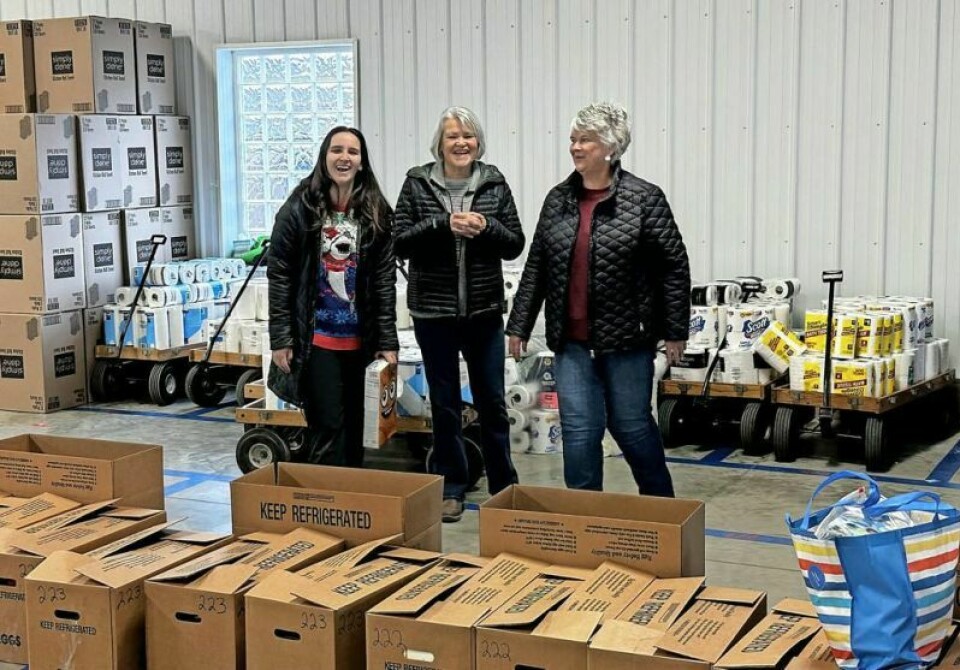 Holmes County Share-a-Christmas volunteer Madeline DeWitt, left, joins Becky Weiss and current SAC collection site administrator Steph Ditmars in the Baker Building, where all of the collected items for SAC are gathered and sorted by family for SAC delivery day. Ditmars is training DeWitt, who is eager to take on a leading role in the organization. DeWitt eager to usher in new group of SAC leadership