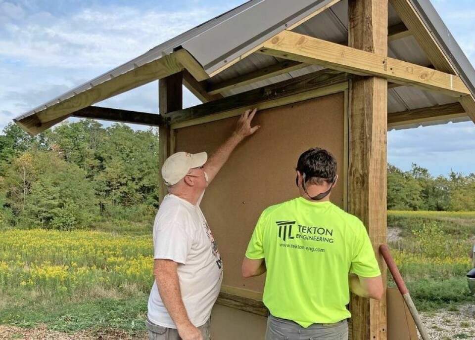Scott and Jason Biltz work on the Legacy Park sign that will serve as a shelter to post upcoming events and more at the soon-to-be-opened park. Community invited to work on projects at Legacy Point