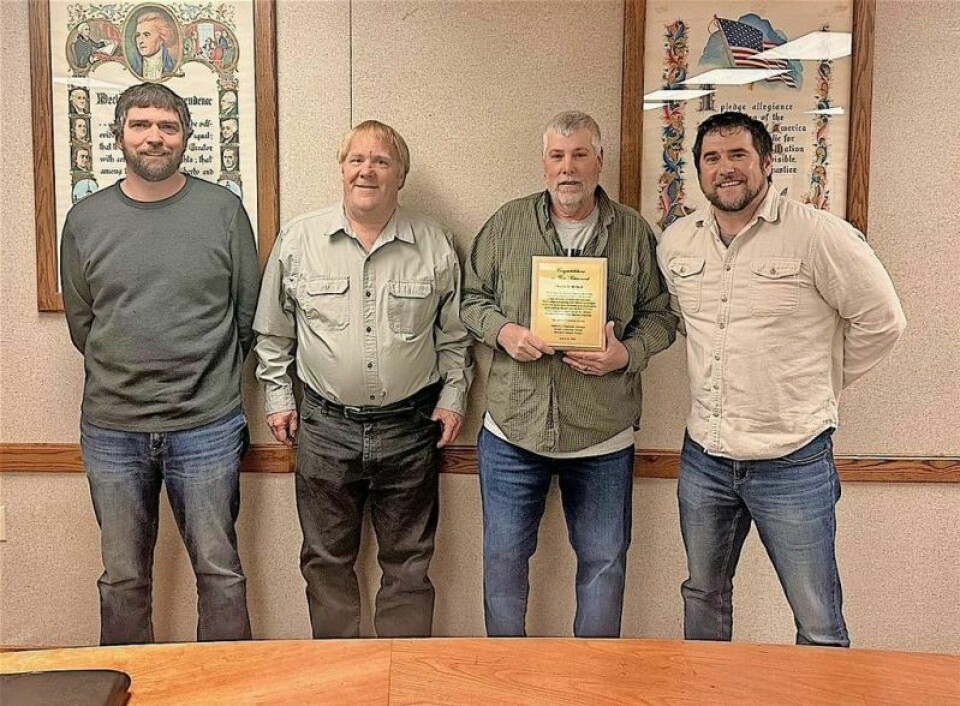 Chuck McNutt, second from right, is joined by Lawrence Township trustees Mike Haueter, Don Ackerman and Matt Ritterbeck, who recognized McNutt upon his retirement at the March 28 trustees meeting. McNutt recognized for his service upon retirement