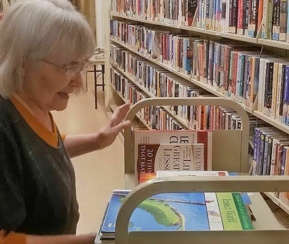 Alice Finley shelves more books in preparation for the Wooster Friends of the Library's annual Spring Book Sale March 14-16. Friends of Library spring book sale March 14-16