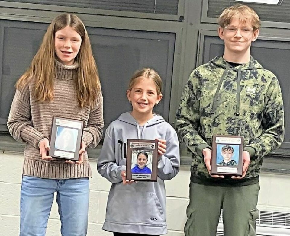 Jillian Sensel, middle school, left; Harper Hershberger, elementary; and Nathaniel Garlinger, high school, were named February Students of the Month. New hires and contracts approved at Strasburg