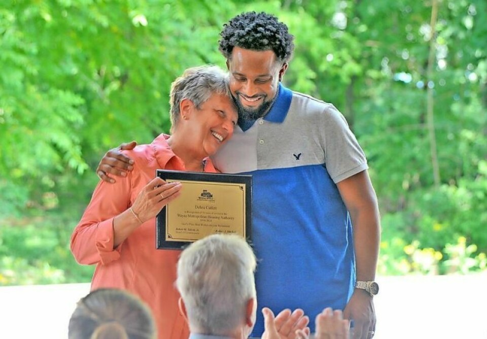 Retiring Wayne Metropolitan Housing Authority Executive Director Deb Catlett, left, and incoming Director Rodney Mitchell embrace after Mitchell presented her with a plaque at the 29th annual Appreciation Day Picnic held at the agency’s training center on Old Columbus Road in Wooster. Mitchell thanked Catlett for being a part of his life personally and being a part of WMHA for more than 30 years. WMHA honors Catlett, hears from Mitchell