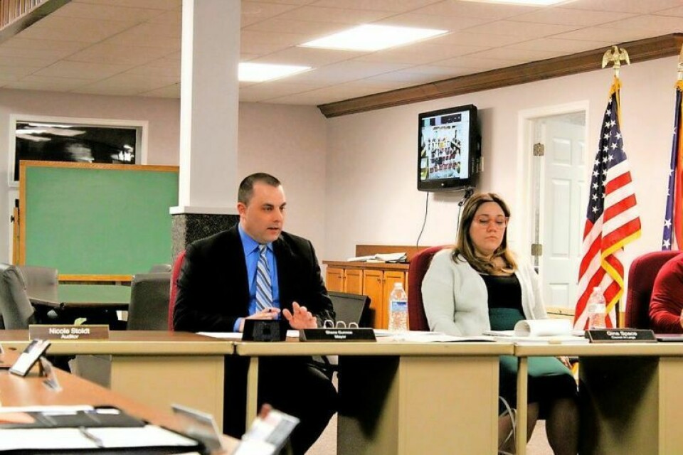Mayor Shane Gunnoe answers a question from a resident about the public hearing on the ALDI zoning change request. ALDI requests zoning change: Public hearing set for March 12