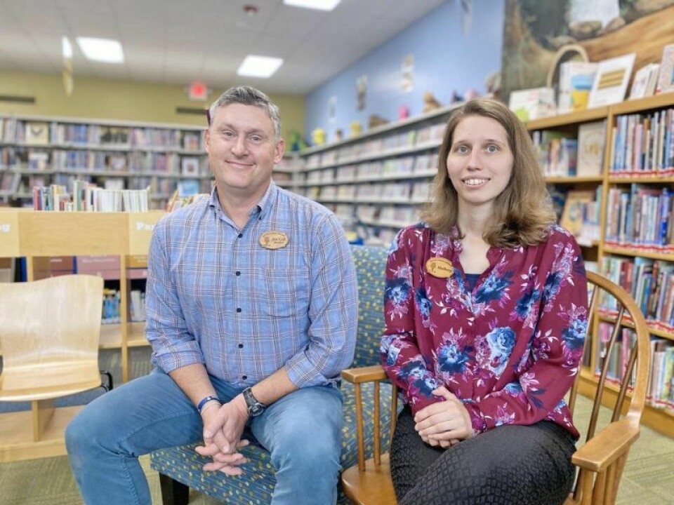 Dover Library Director Jim Gill and librarian Mallory Thompson help bring physical materials and online offerings to 17,000 plus library cardholders. September is Library Card Sign-up Month