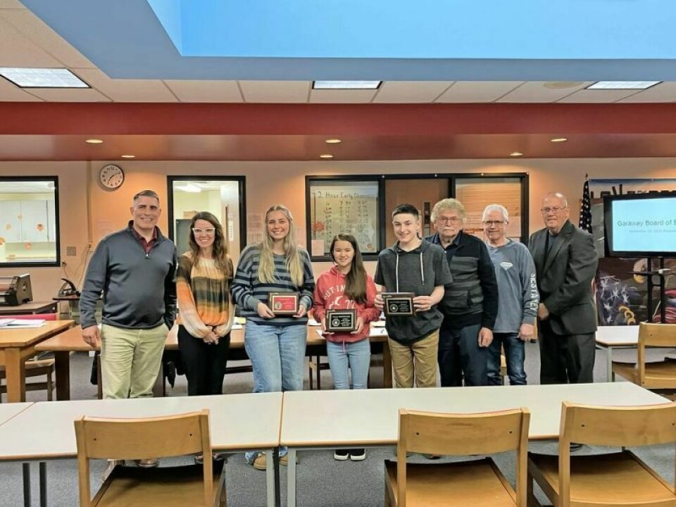 Mike Warkall, board member, left; April Beachy, board member; Faith Head, Artist of Month; Calli Hostetler, Middle School Student of the Month; Matthew Raber, High School Student of the Month; and Robert Eckert, John Shrock and Bob Hannon, all board members Garaway BOE recognizes Oct. Students of the Month