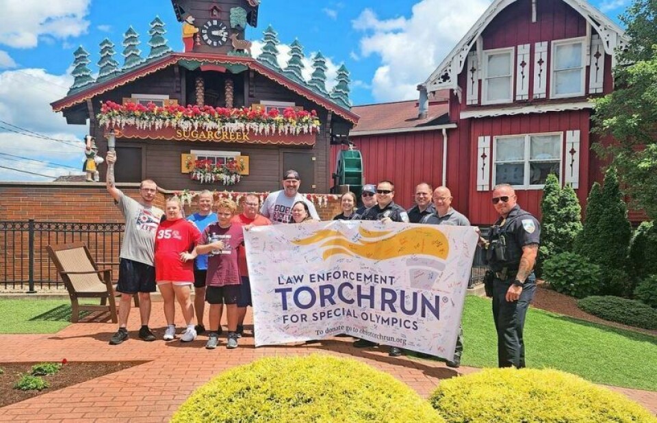 Members of local law enforcement at Sugarcreek Police Department united with individuals with special needs along with Nate Samples, Ohio LETR Northeast director, when the Torch of Hope paid a visit to Sugarcreek on Thursday, June 27. Torch of Hope unites law enforcement with Special Olympics