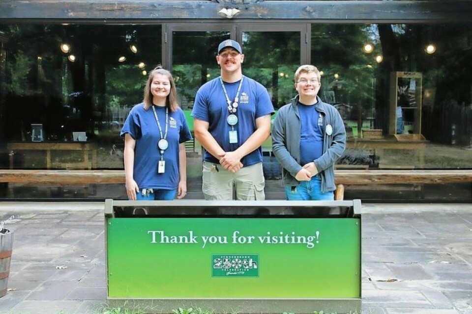 Kayla Gamble, left, Tanner Immel and Harry Harman are ready to welcome guests to the Schoenbrunn Village lantern tours. Schoenbrunn to hold fall lantern tours Sept. 27-28