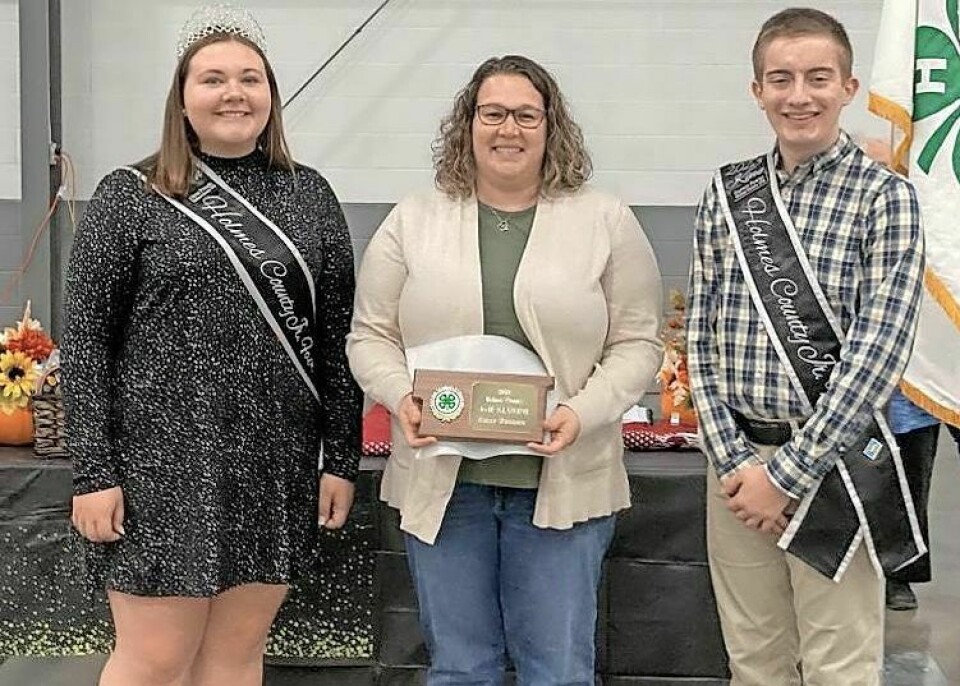 Holmes County 4-H Alumni Award winner Kelly Reusser, middle, pictured with the 2023 Holmes County Fair King Garrett Fowler and Queen Alysa Pringle. Holmes County 4-H holds volunteer recognition banquet