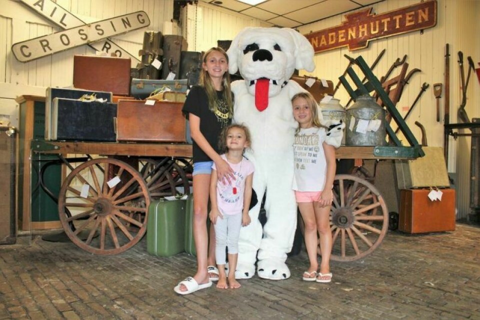 Sophie Ruth, 10, Mya Ochsenbine, 3, and Aspen Ruth, 6, of Uhrichsville with Bing, the mascot of the Dennison Depot Railroad Museum. The Jammin’ Food Truck Festival is being held in Dennison this year. Jammin’ Food Truck Festival moves to new location