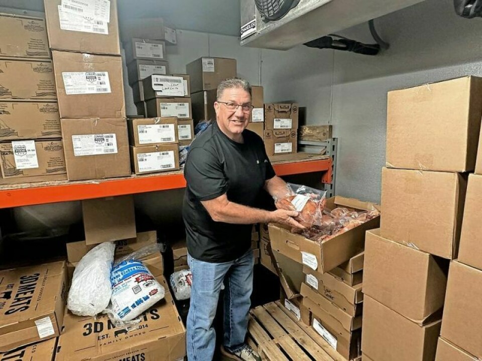 Edgar Raber, executive director of Love Center Food Pantry in Millersburg, showcases a small portion of the meat donated to the center by area businesses that made animal purchases at the fair livestock sale. The meat goes a long way in providing for area families. Fair livestock auction donations crucial to area nonprofits